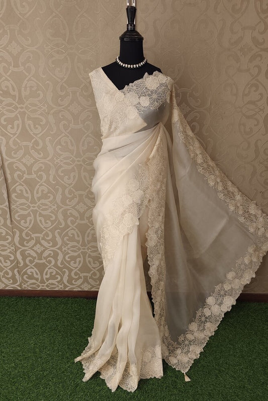 Off-White Organza Silk Saree with Resham Embroidery and unstiched blouse, perfect for party wear from Saarang Sarees.