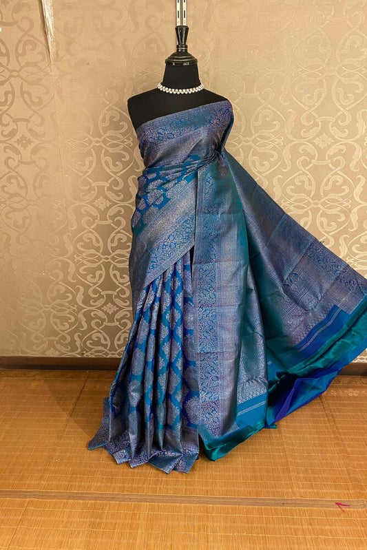 Peacock blue pure Kanjeevaram silk saree with intricate traditional designs and an unstiched blouse, by Saarang Sarees.