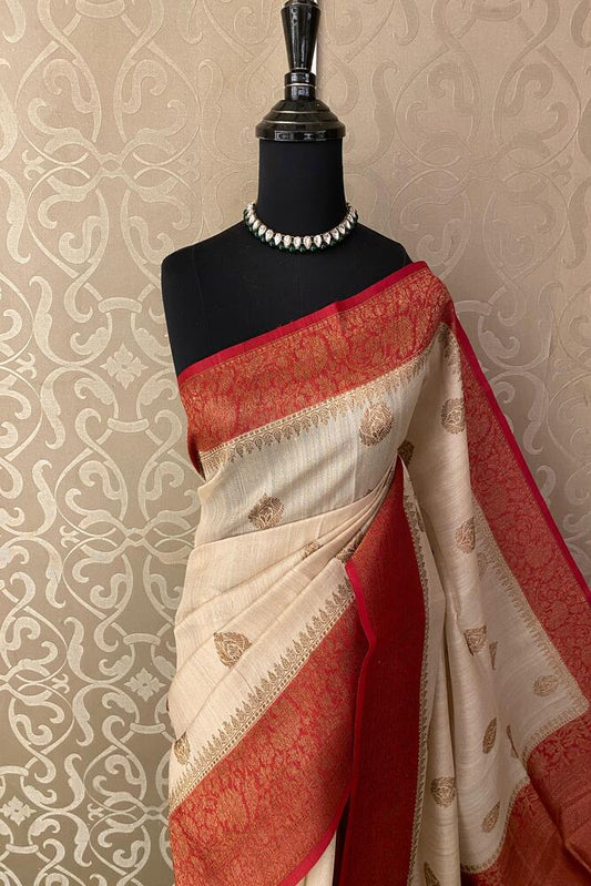 Off-White Tussar Banarasi Silk Saree by Saarang Sarees with hand-woven motifs and an unstiched blouse, traditional wear.