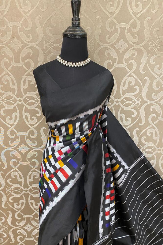 Black and multi-colored Pochampally Ikat silk saree from Saarang Sarees with an unstiched blouse, traditional Indian wear.