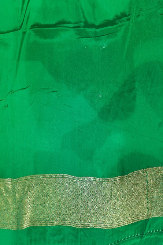 Deep green brocade crepe Khaddi silk saree with unstitched blouse, perfect for party wear, by Saarang Sarees.