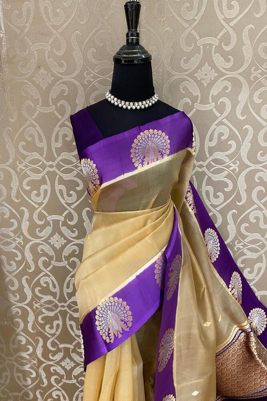 Beige and violet Muslin Kora Banarasi silk saree from Saarang Sarees with traditional design and unstiched blouse.