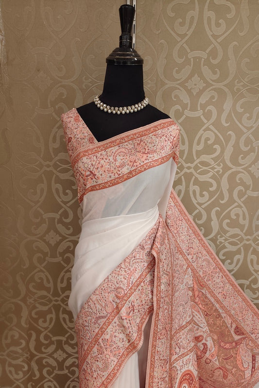 Off-White Pure Kani handloom silk saree with floral woven blouse, traditional wear from Saarang Sarees, intricate design details visible.