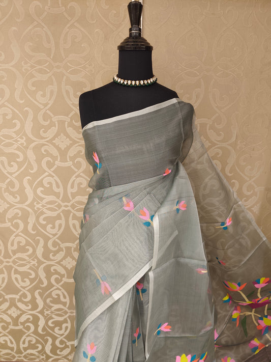 Grey muslin Dhakai saree from Saarang Sarees showing intricate traditional Dhakai design without blouse.