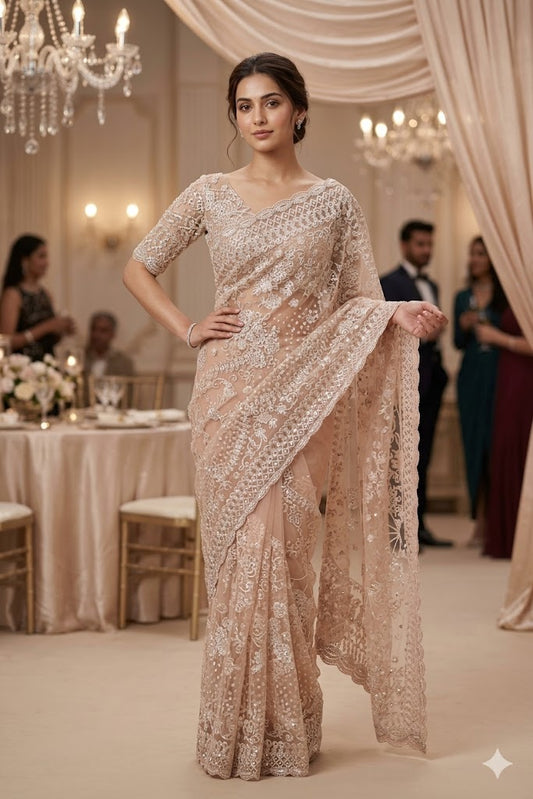 Pink party wear net embroidered saree with matching readymade blouse, stylish and elegant for special occasions.