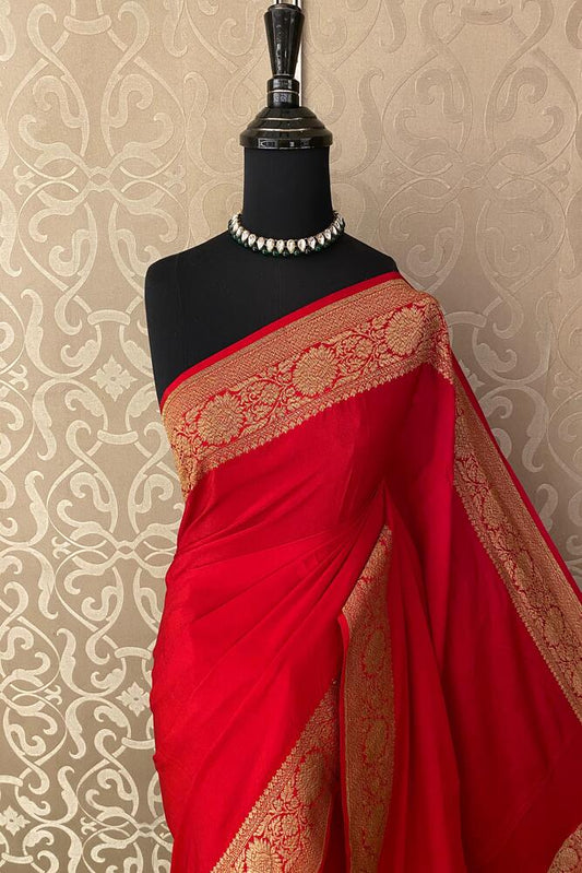 Cherry red Mysore crepe silk Banarasi saree from Saarang Sarees with intricate gold zari work and matching unstiched blouse.