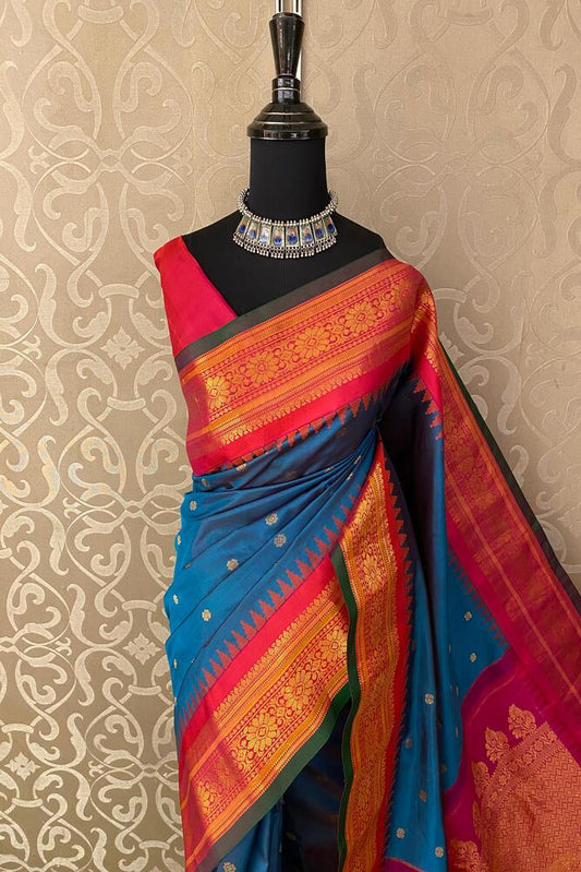 Royal blue Gadwal silk saree with traditional unstiched blouse from Saarang Sarees, featuring intricate zari work and rich fabric.