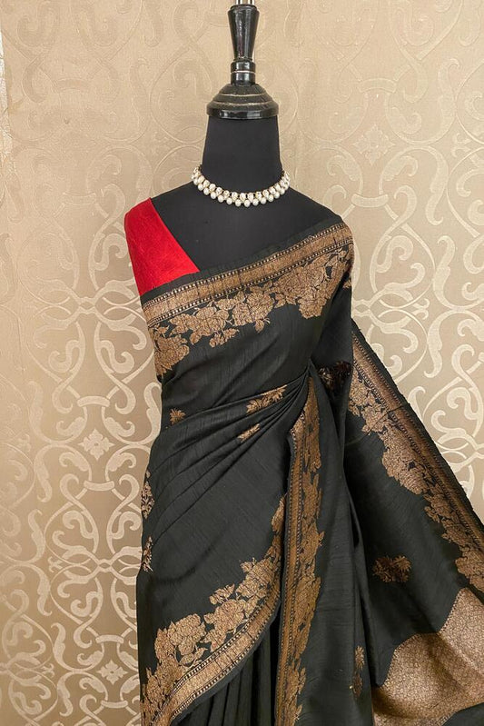 Black pure raw Tussar Banarasi silk saree with handwoven motifs and an unstitched blouse for traditional wear.