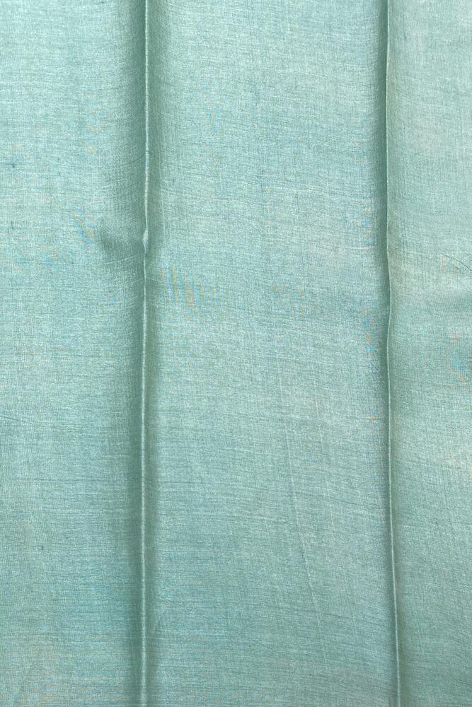 Deep green tussar silk printed saree with traditional design and matching unstiched blouse from Saarang Sarees.