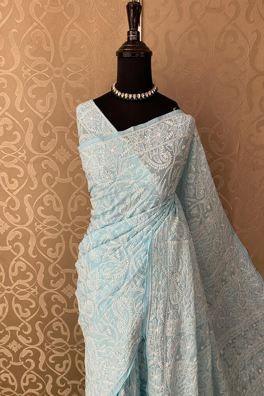 Sky blue cotton Chikankari saree with intricate embroidery and an unstiched blouse, perfect for party wear by Saarang Sarees.