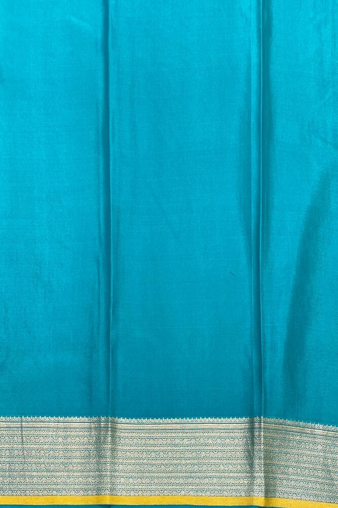 Firozi Mysore crepe silk Banarasi saree with intricate gold zari work and matching unstiched blouse, traditional Indian attire.