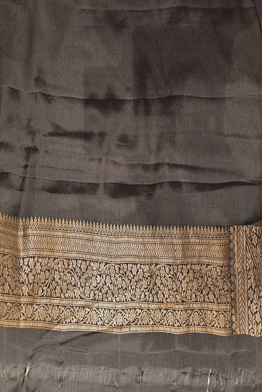 Black brocade crepe Khaddi silk saree with intricate design, paired with unstitched blouse for party wear by Saarang Sarees.