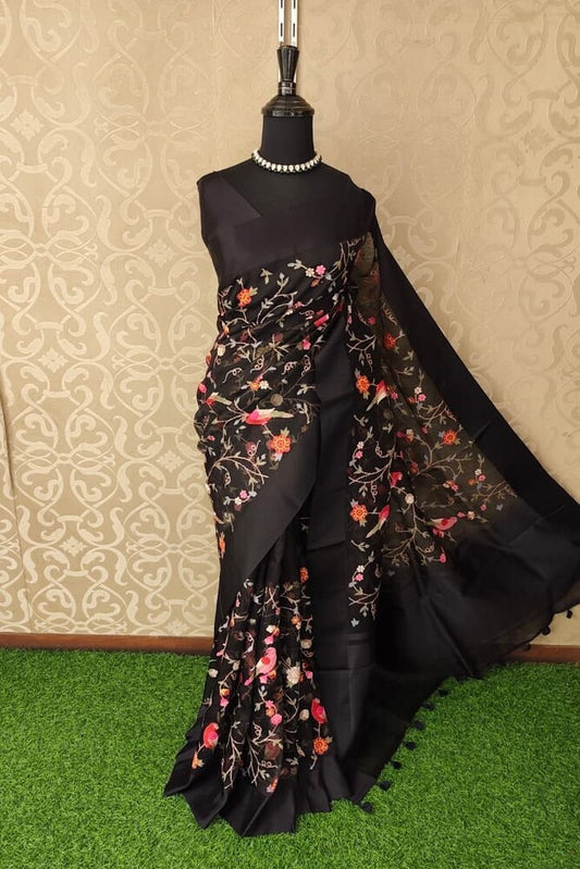 Black organza silk saree with cross-stitch work and unstiched blouse, ideal for party wear by Saarang Sarees.