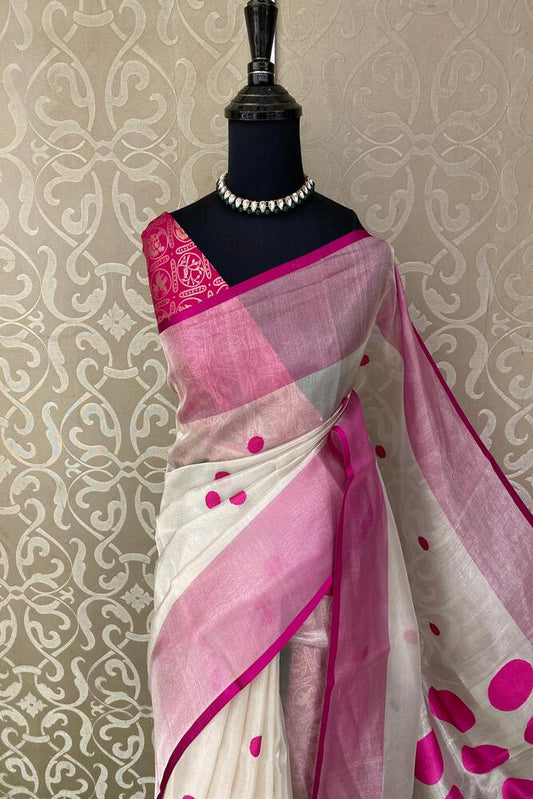 White and purple tissue Banarasi silk saree with intricate patterns and an unstiched blouse, traditional wear by Saarang Sarees.