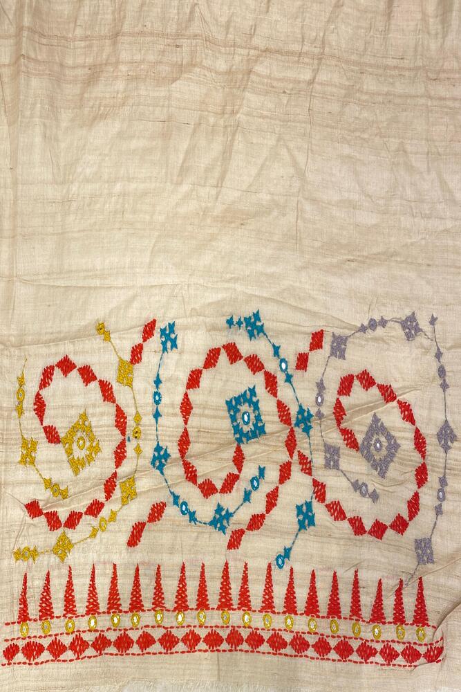 Beige Tussar Lambani and Kutch work saree from Saarang Sarees with stitched blouse, traditional Indian ethnic wear.