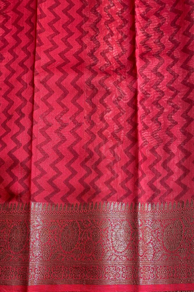 Brown cotton Chanderi saree with intricate border and draped style, paired with an unstiched blouse, traditional wear by Saarang Sarees.