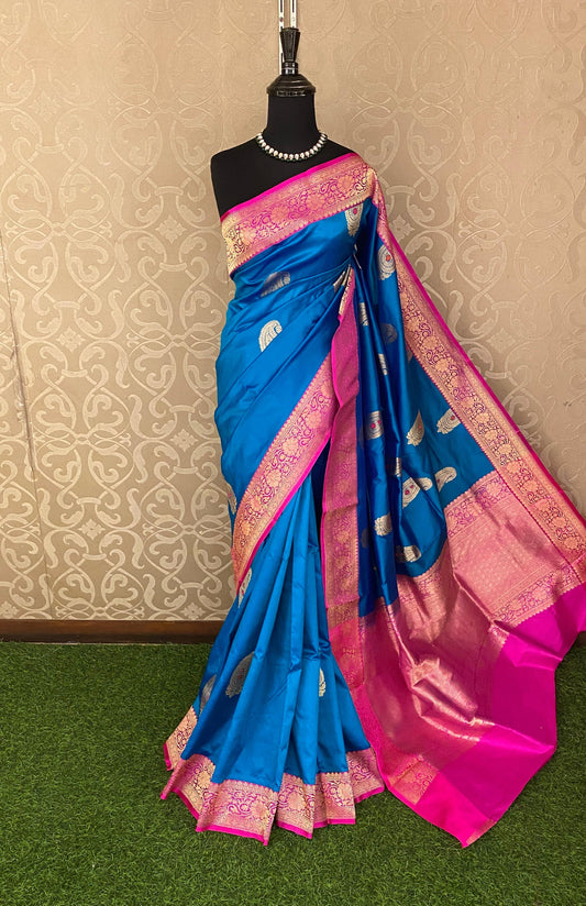 Royal blue Katan Banarasi saree by Saarang Sarees with intricate handwoven work and matching unstiched blouse, traditional wear.