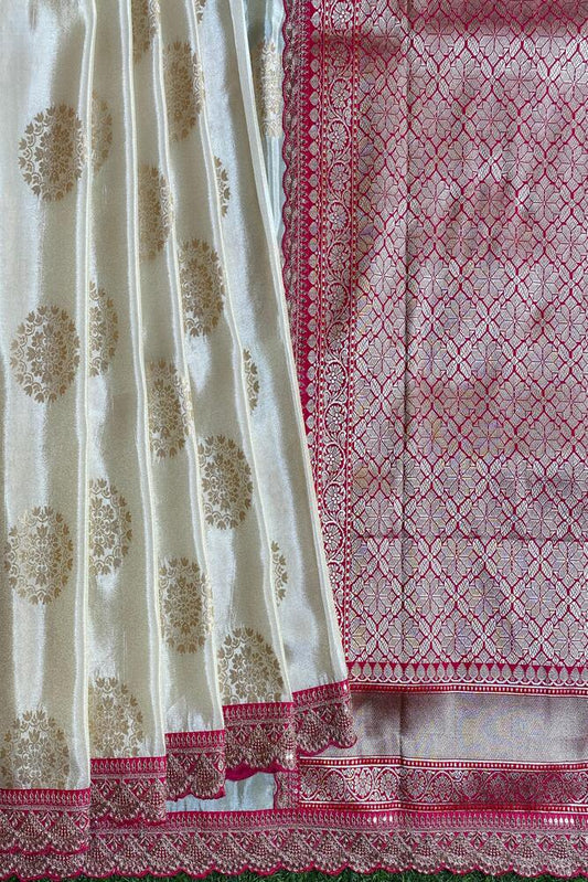 Off-White gold tissue Khaddi saree with embroidery border and unstiched blouse from Saarang Sarees, traditional Indian attire.