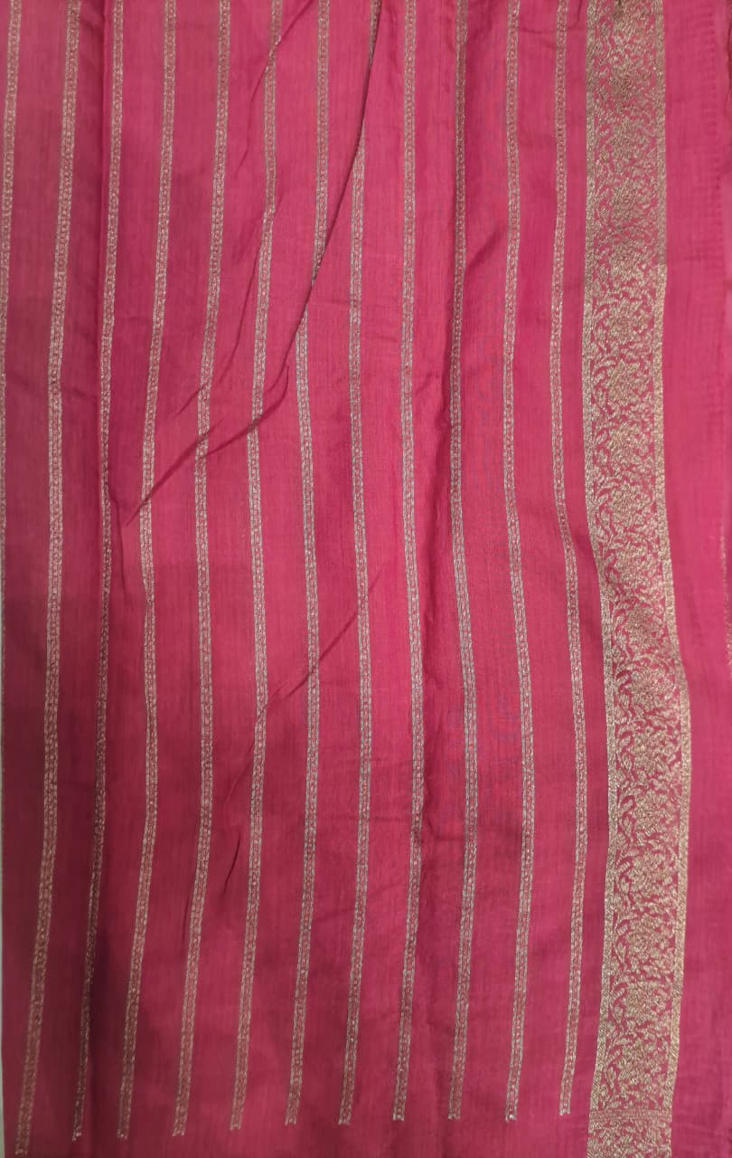 Deep beige Munga Banarasi silk saree with intricate zari work and an unstiched blouse, showcasing traditional Indian craftsmanship.