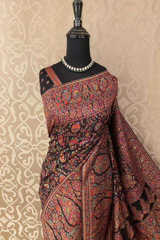 Traditional Multi Pure Kani handloom silk saree with floral woven blouse, showcasing intricate patterns and vibrant silk fabric.