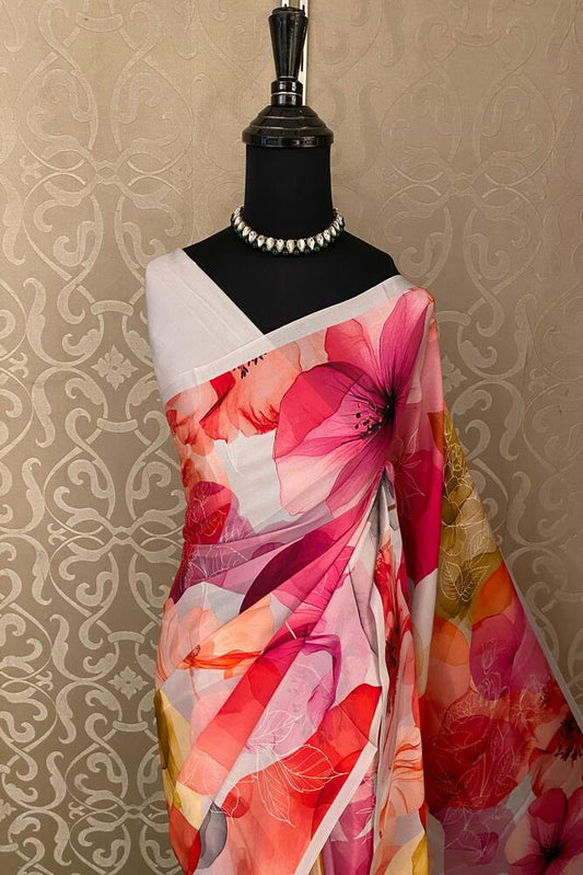 White and multi-floral printed satin crepe saree with unstiched blouse, perfect for party wear from Saarang Sarees.