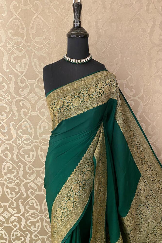 Deep green Mysore crepe silk Banarasi saree with intricate gold zari work and an unstiched matching blouse, traditional wear by Saarang Sarees.