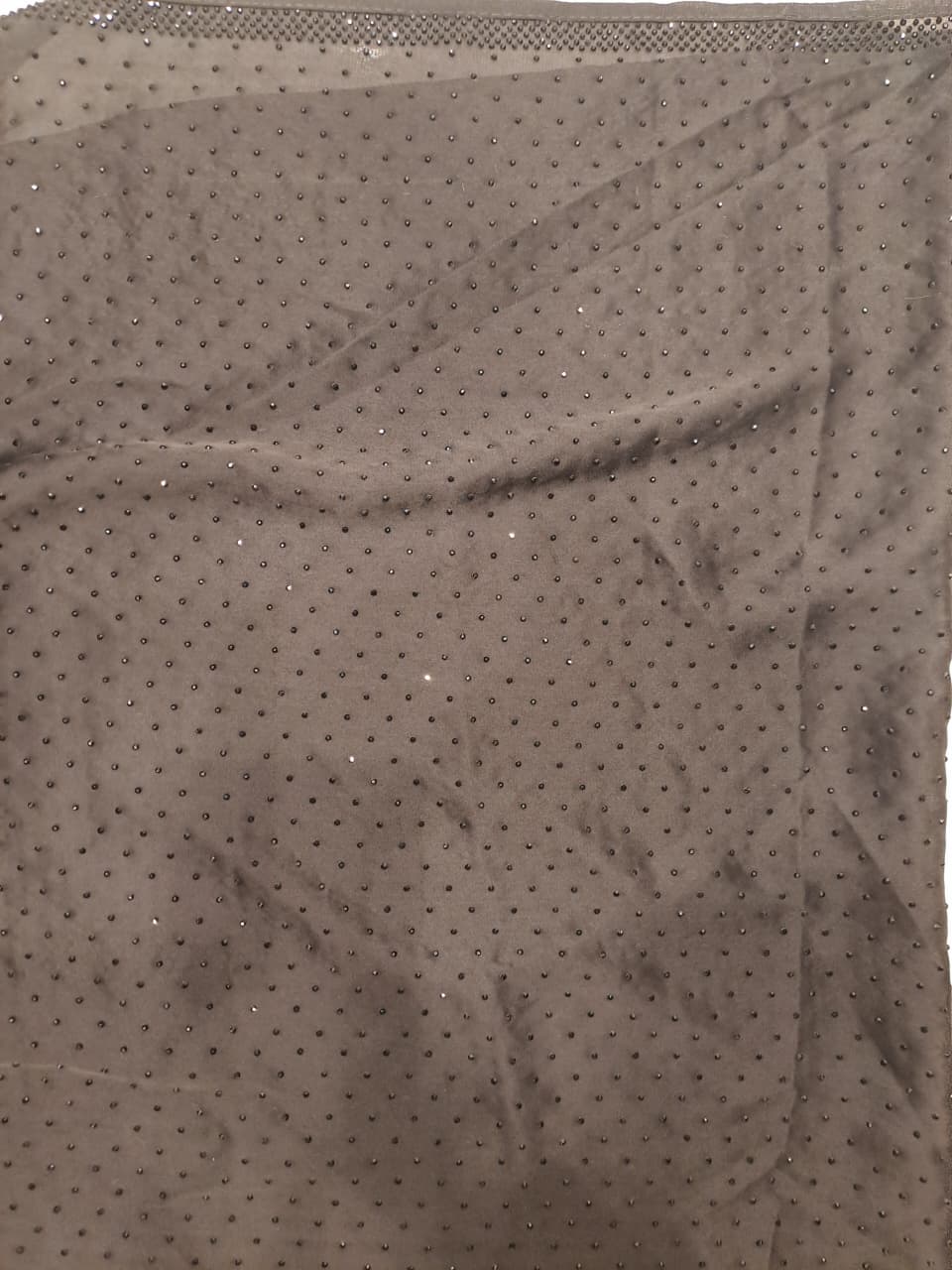 Black satin crepe silk saree with full stone work and unstiched blouse, ideal for party wear, by Saarang Sarees.