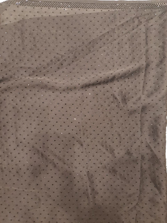 Black satin crepe silk saree with full stone work and unstiched blouse, ideal for party wear, by Saarang Sarees.