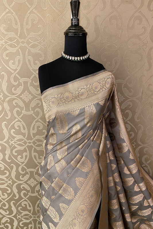 Grey Uppada Banarasi saree with intricate gold zari work and an unstiched blouse, traditional Indian wear by Saarang Sarees.