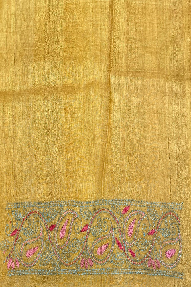Mustard yellow Tussar saree with Lambani work and unstitched blouse from Saarang Sarees, showcasing traditional craftsmanship and vibrant color.