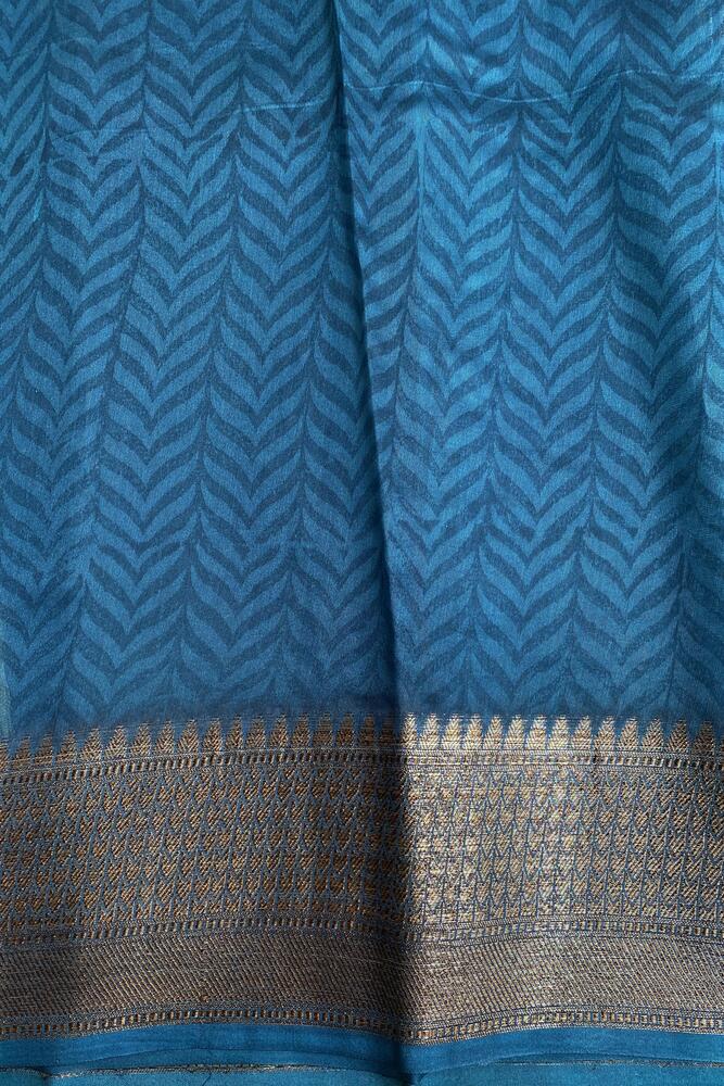 Blue cotton Chanderi saree with intricate border and draped style, paired with an unstiched blouse from Saarang Sarees.