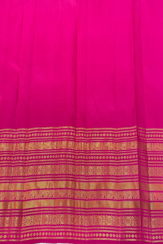 Rani pure Kanjeevaram silk saree with intricate gold zari work and matching unstiched blouse, traditional Indian attire.