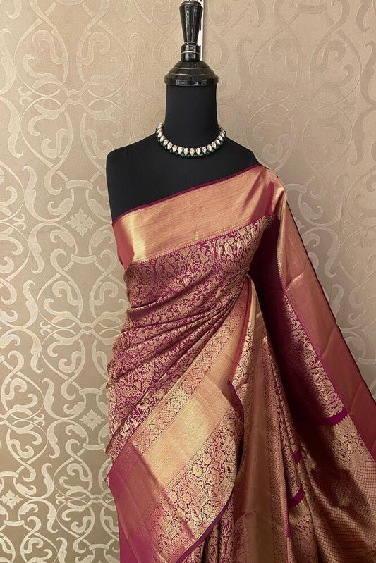 Deep purple pure Kanjeevaram silk saree with intricate gold zari work and matching unstiched blouse from Saarang Sarees.