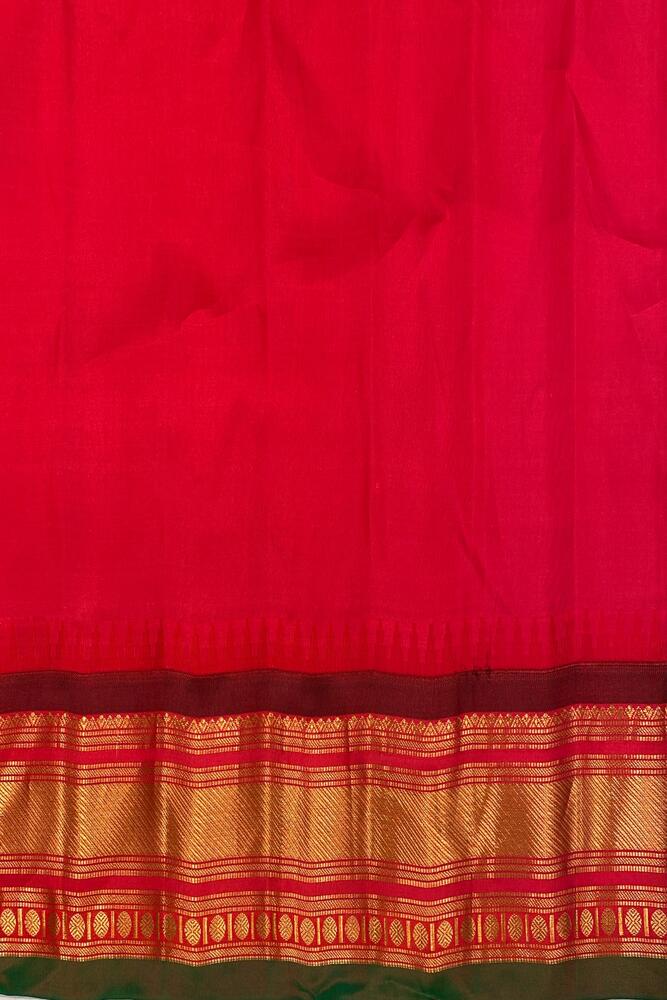 Off-White Gadwal Silk Saree from Saarang Sarees with an unstiched blouse, showcasing intricate traditional Indian weaving and vibrant fabric.