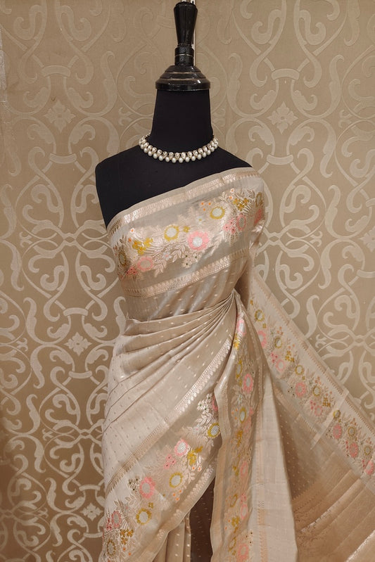 Light grey Chiniya silk saree with handwoven butas and an unstiched blouse, traditional wear by Saarang Sarees.