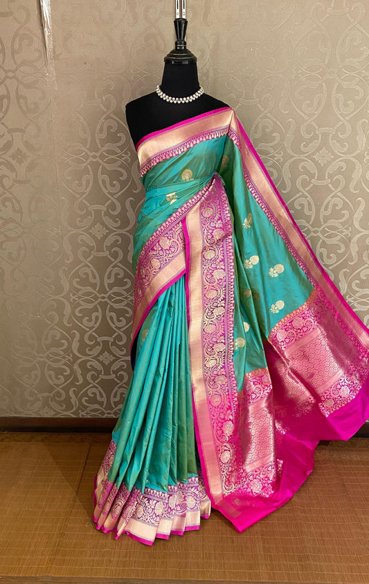 Rama Green Katan Banarasi saree by Saarang Sarees featuring handwoven traditional work and an unstitched blouse.