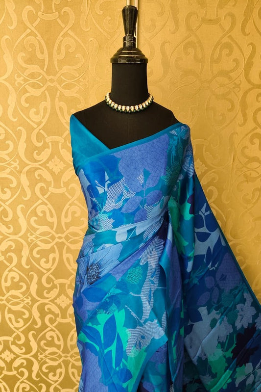 Blue floral printed satin crepe saree with unstiched blouse, perfect for party wear by Saarang Sarees.