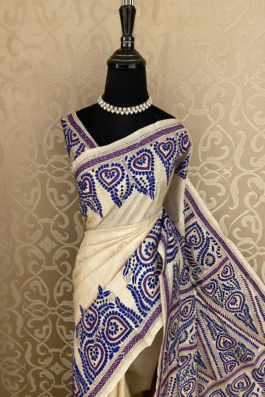 Beige Tussar embroidery saree with Kantha work border and matching unstitched blouse, traditional wear by Saarang Sarees.