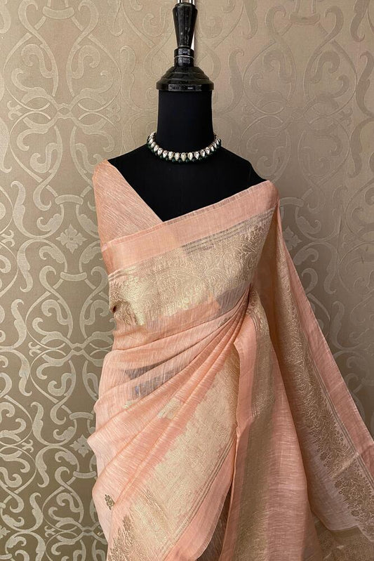 Peach pure linen saree with traditional design and unstiched blouse from Saarang Sarees, displayed on a mannequin.