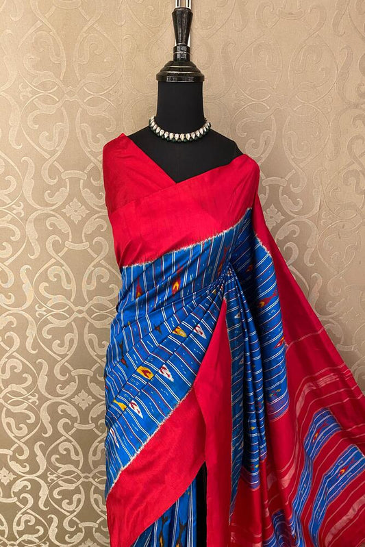 Blue Pochampally Ikat silk saree with intricate traditional patterns and matching unstiched blouse from Saarang Sarees.