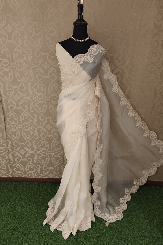 Off-White Organza Silk Saree with Resham Embroidery and unstiched blouse, perfect for party wear by Saarang Sarees.