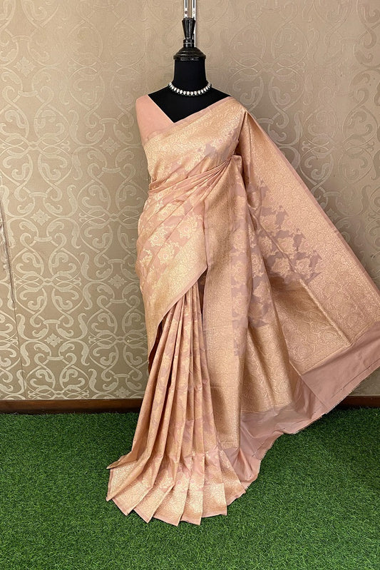 Peach Uppada Banarasi saree with intricate gold zari work and matching unstiched blouse, traditional Indian wear by Saarang Sarees.