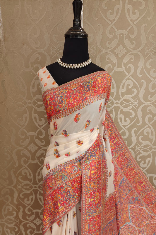 Off-White Pure Kani handloom silk saree with floral woven blouse, traditional wear by Saarang Sarees, showcasing intricate design and craftsmanship.
