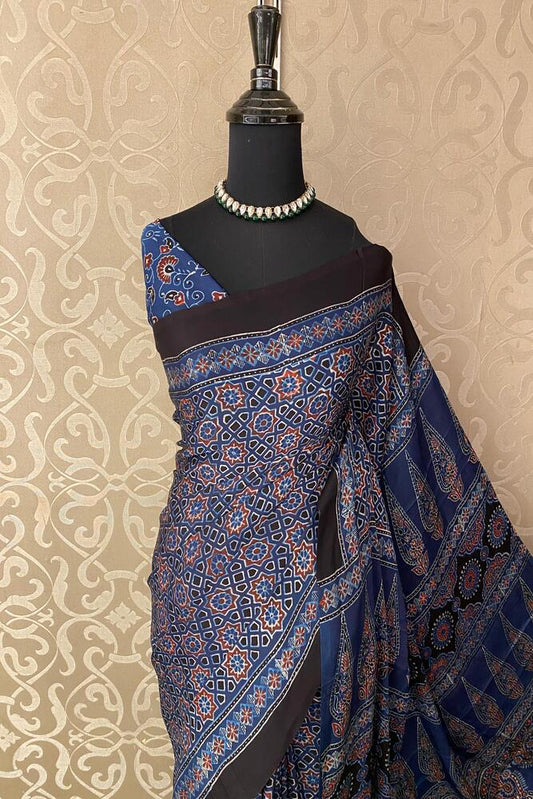 Deep blue pure modal silk Ajrakh printed saree with unstiched blouse from Saarang Sarees, traditional Indian wear with intricate patterns.
