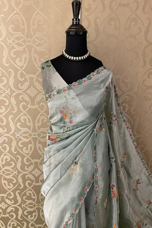 Greyish blue party wear saree by Saarang Sarees with intricate Aari work and unstiched blouse, perfect for special occasions.