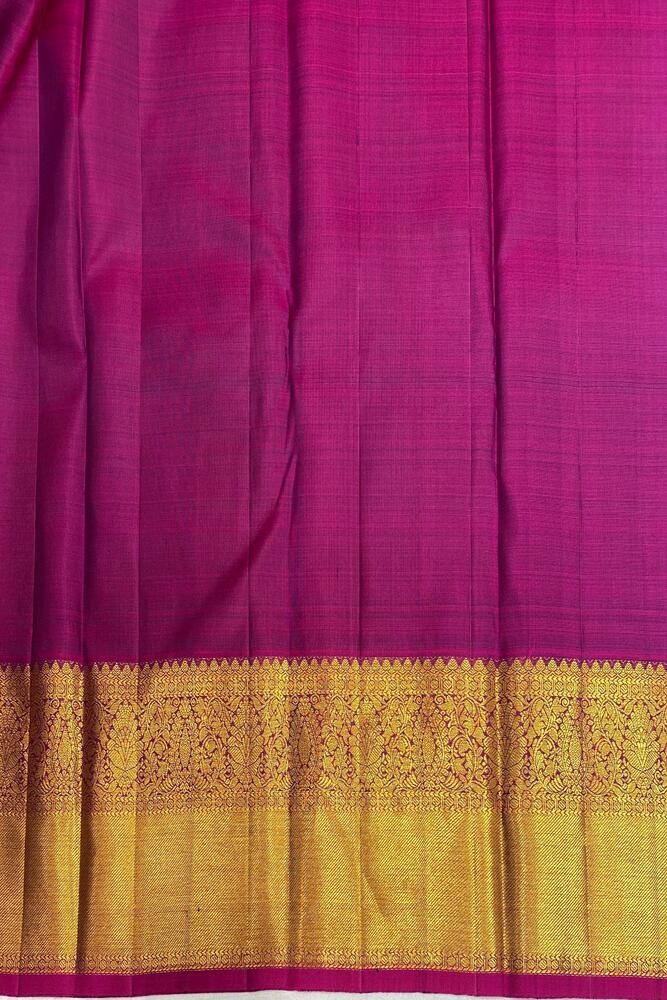 Bottle green pure Kanjeevaram silk saree with intricate gold zari work and unstiched matching blouse, traditional Indian attire from Saarang Sarees.