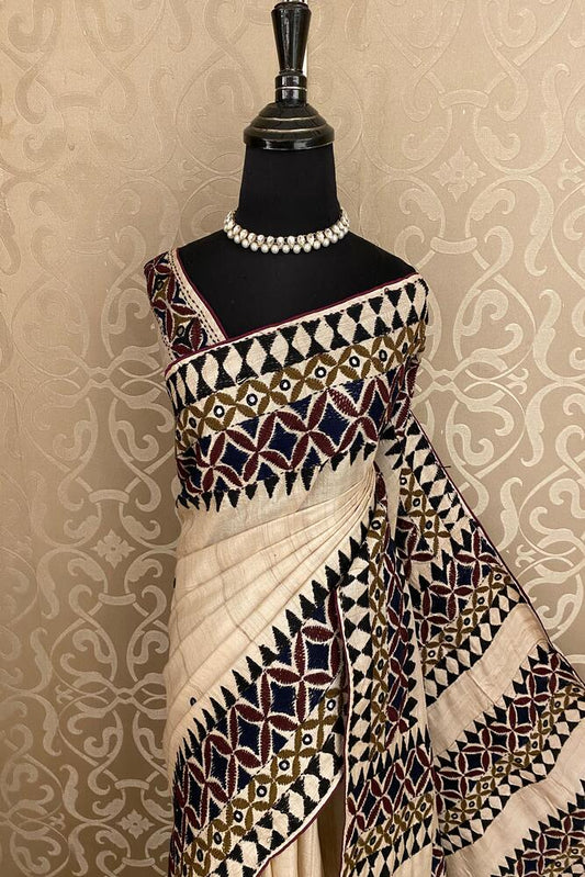 Beige Tussar Gujarati work saree with intricate embroidery and matching unstiched blouse, traditional Indian wear by Saarang Sarees