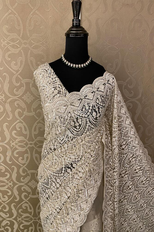 Off-White party wear net embroidered saree with matching readymade blouse, elegant traditional attire for special occasions.