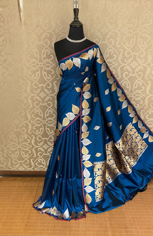 Royal blue Katan Banarasi saree with intricate handwoven work and matching unstiched blouse, traditional Indian wear by Saarang Sarees.