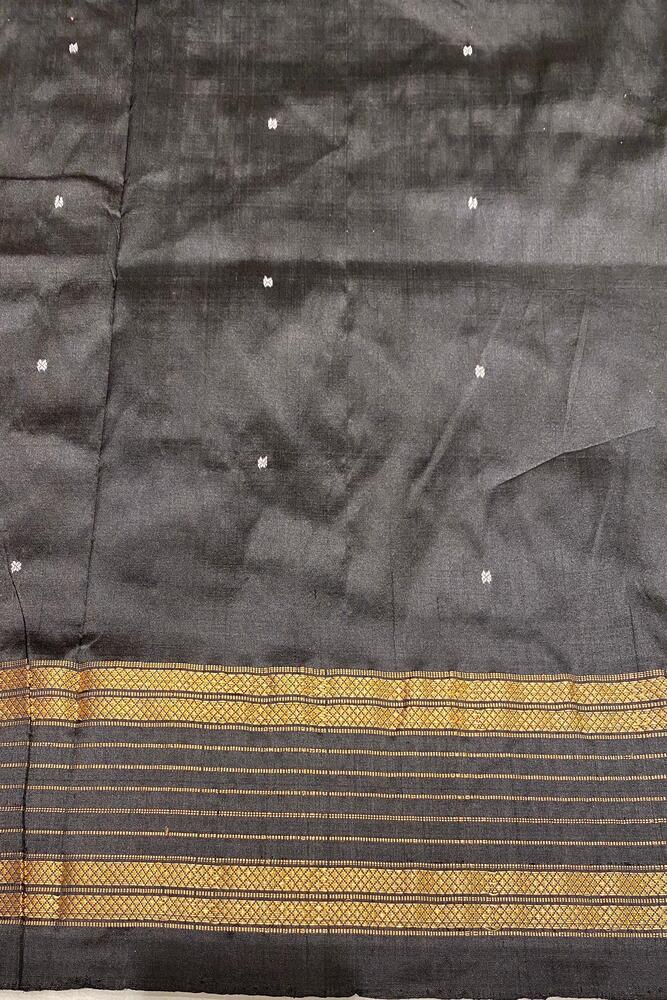 Red and multi-colored Pochampally Ikat silk saree from Saarang Sarees with a matching unstiched blouse, traditional wear with intricate patterns.